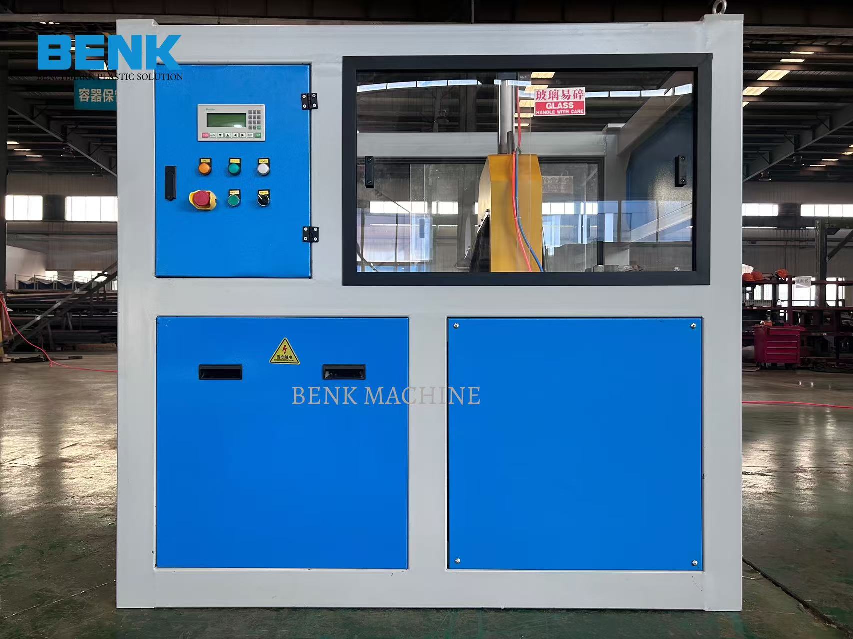 A cutter machine by BENK MACHINE, featuring a digital display and various control buttons.